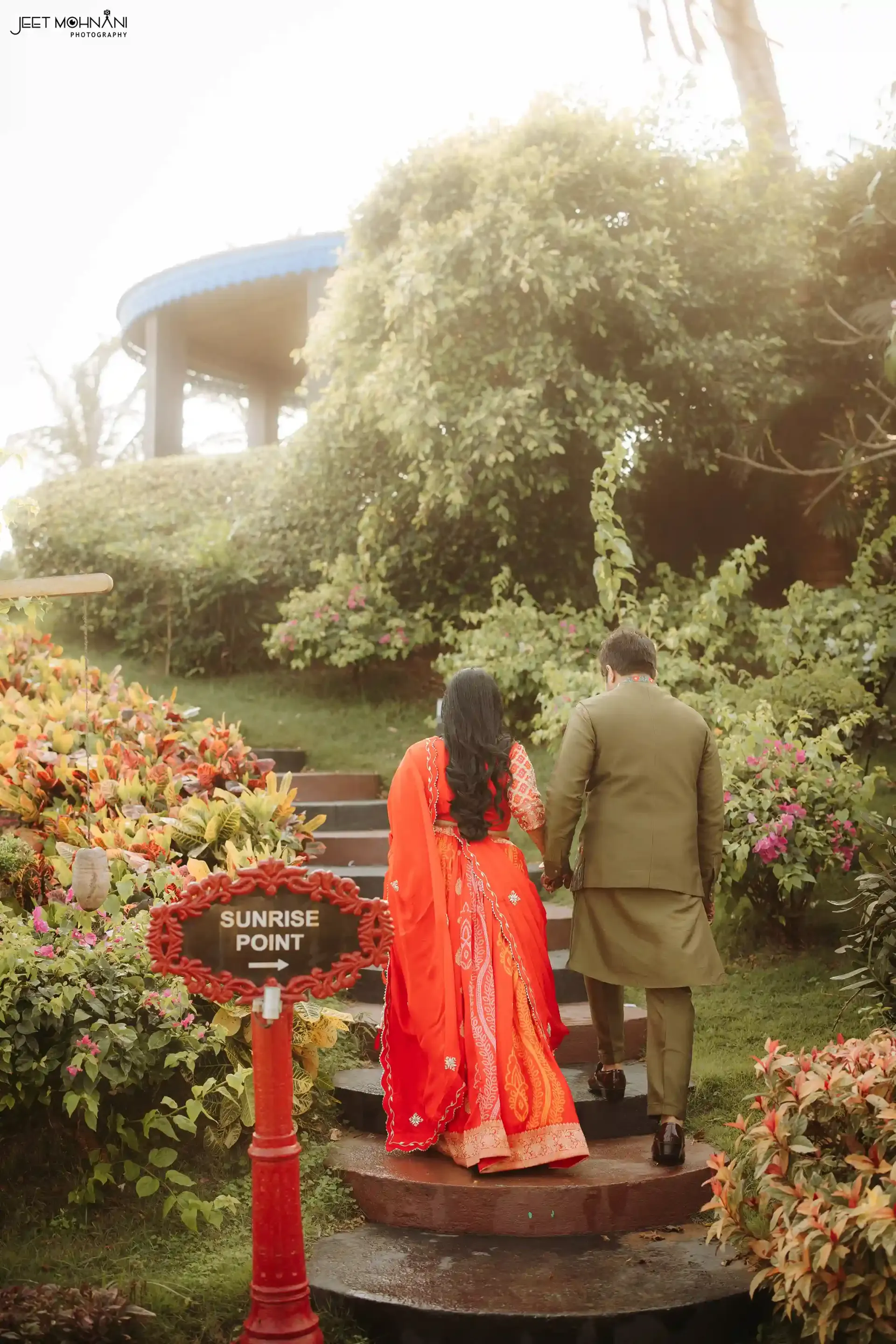 The couple photographed close, lit by warm evening light